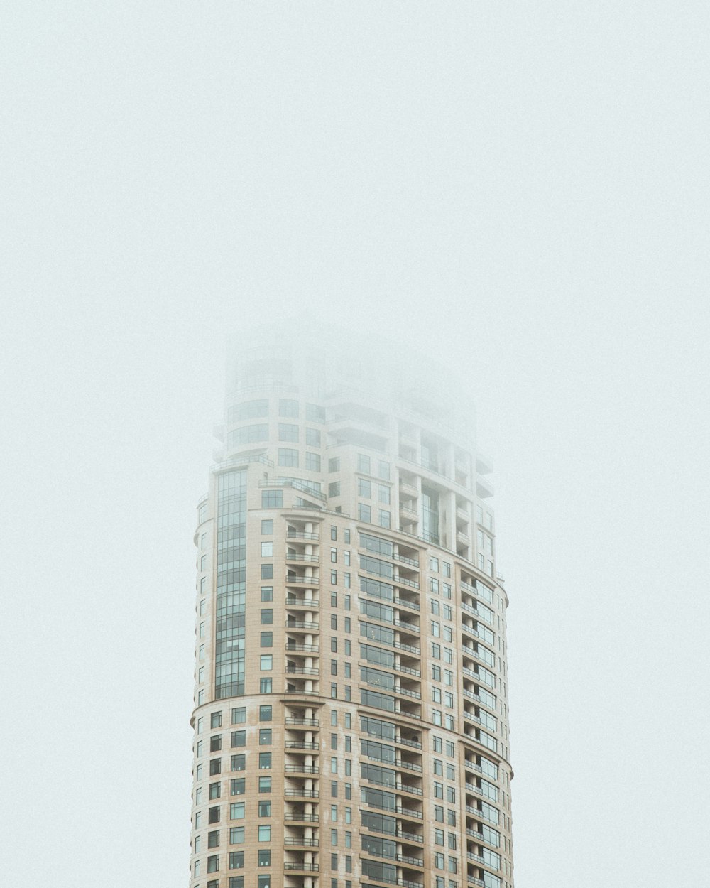 a very tall building with a clock on it's side