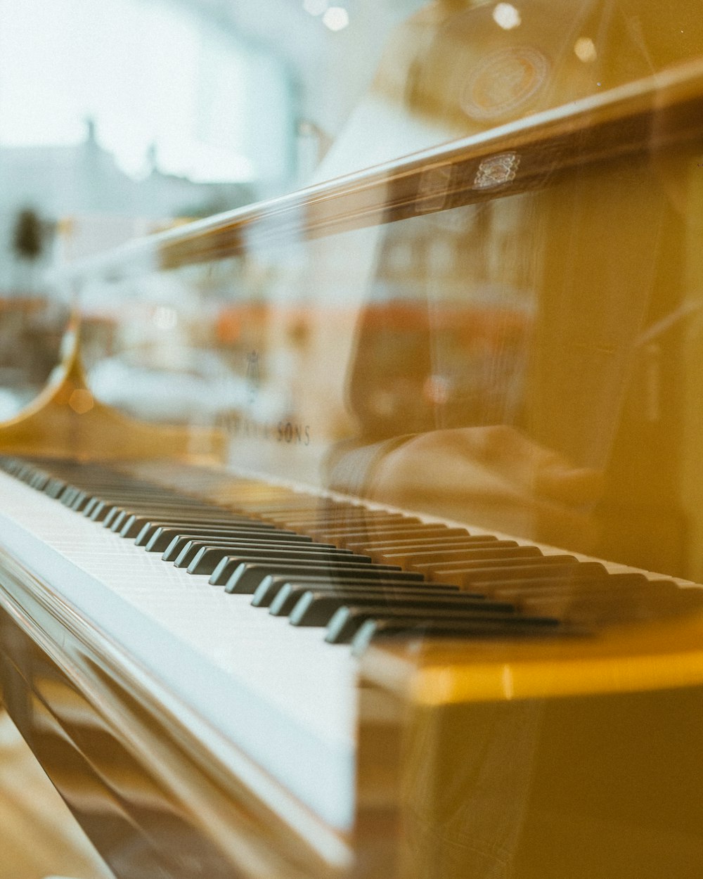 low-angle of brown piano