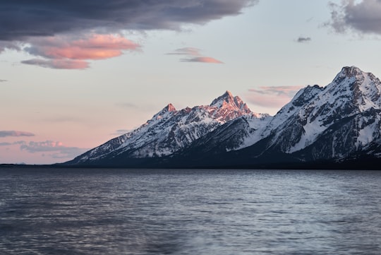 landscape photography of mountain near body of water in Grand Teton National Park United States