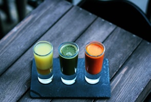 three clear shot glasses