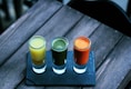 three clear shot glasses