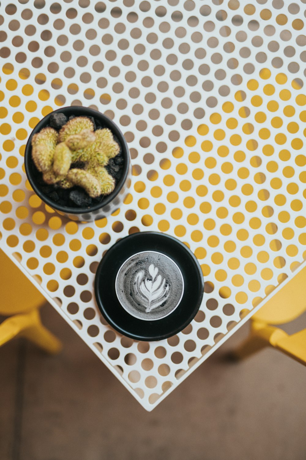 two round black ceramic containers