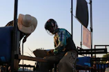 Close-up of a rodeo performer preparing for a bull ride