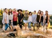 group of women standing on rock fragment
