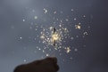 person holding lighted sparklers. pétillement.