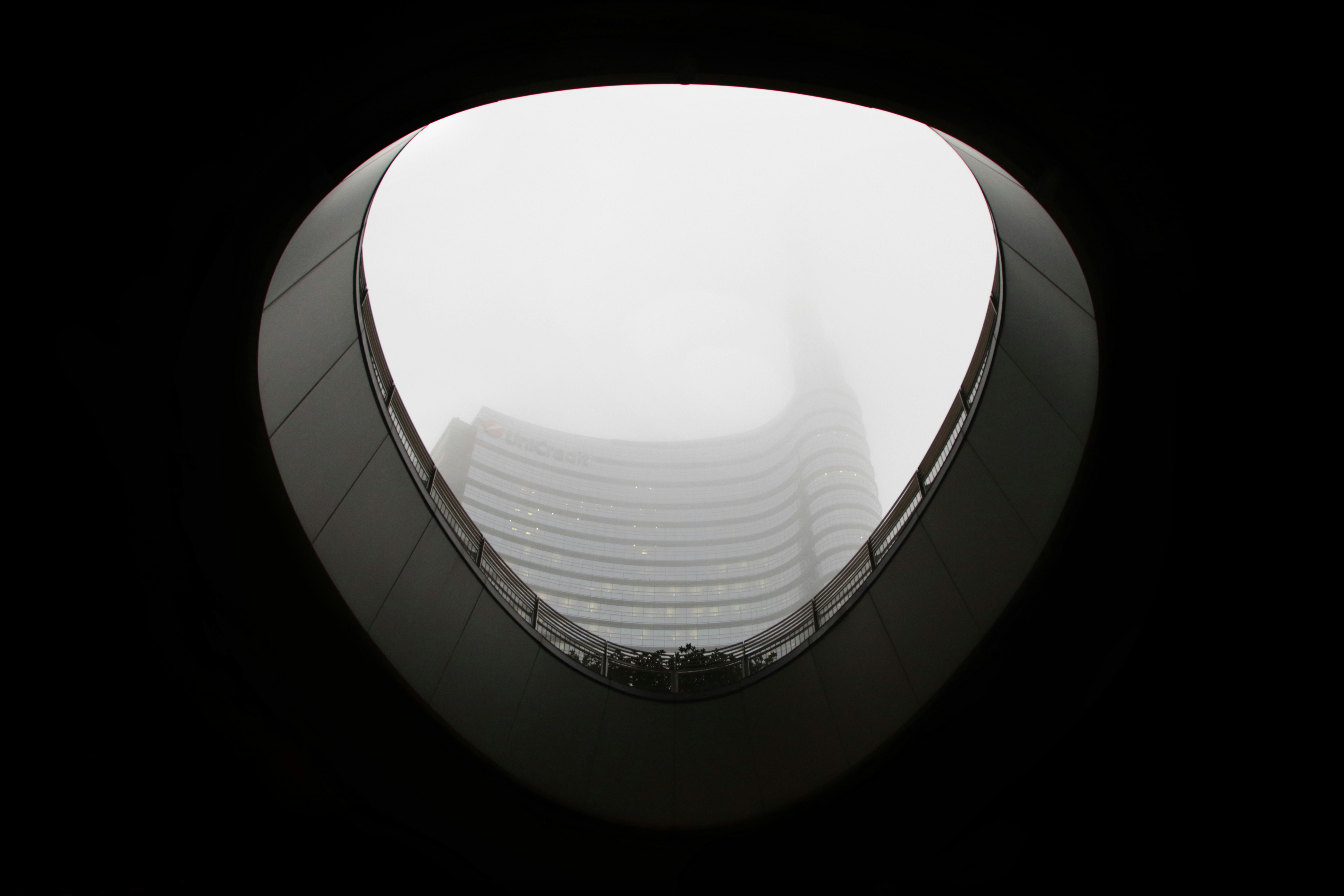 monochrome building roof hole