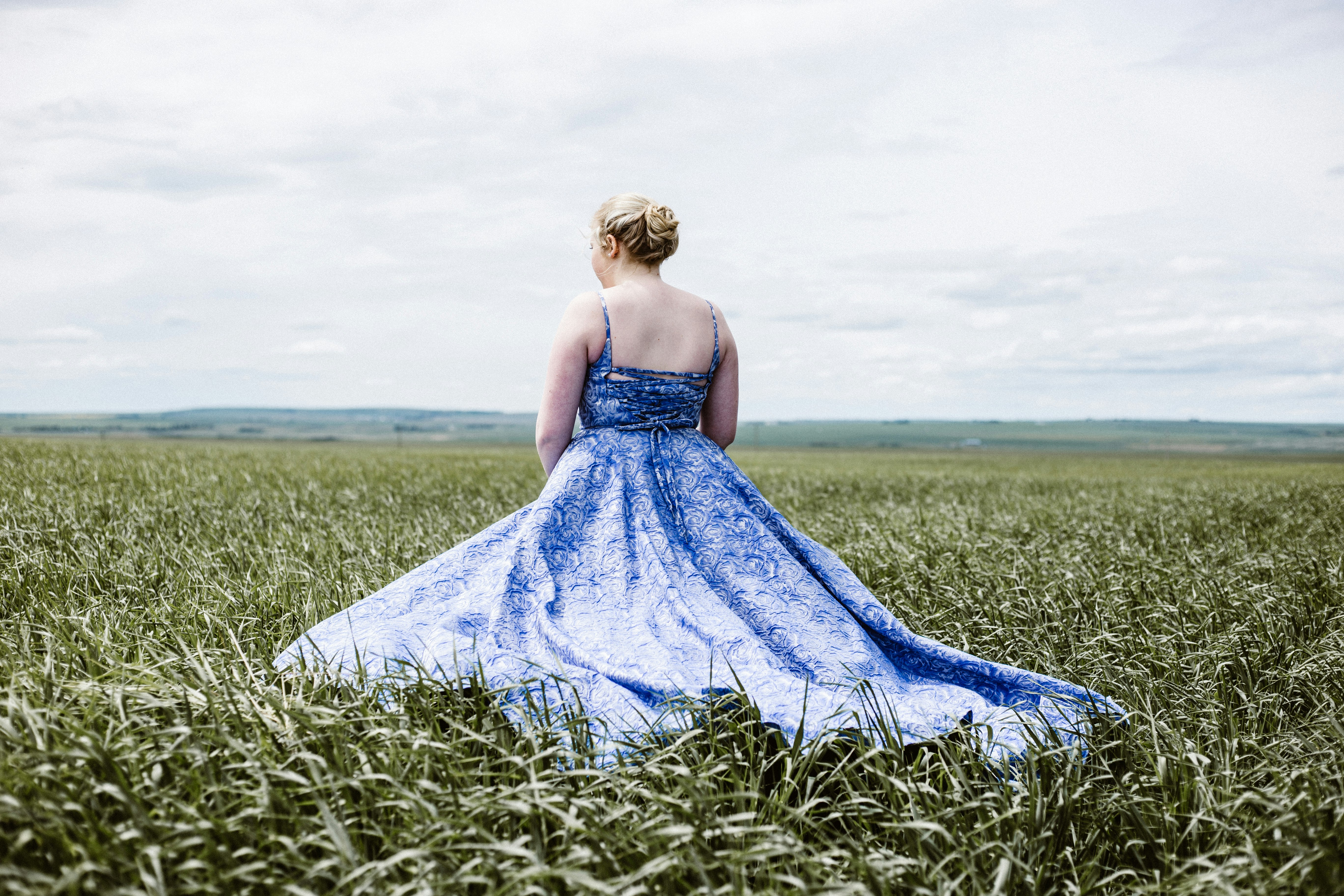 woman standing on green grass field