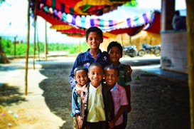 five boys standing outdoor focus photography