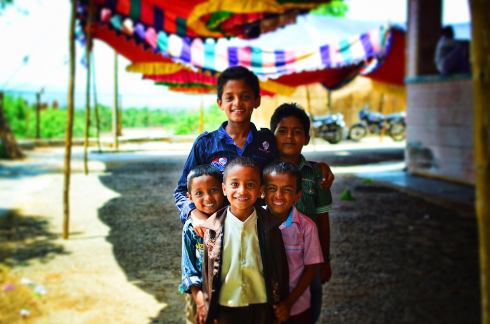 five boys standing outdoor focus photography