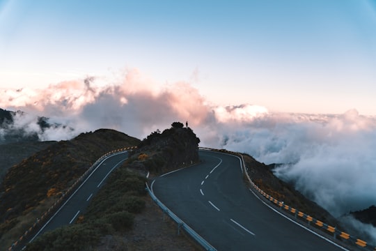 road on hill surrounded with clouds in Madeira Portugal
