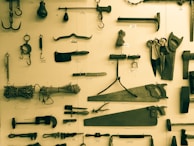 Old kitchen installation tools displayed neatly on a metal shelf.