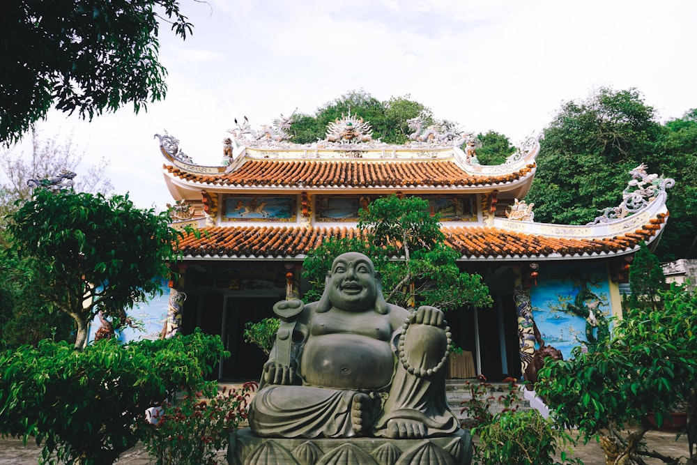 brown and white temple under white clouds during daytime