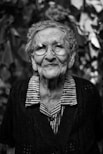 grayscale photography of woman standing