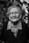 grayscale photography of woman standing