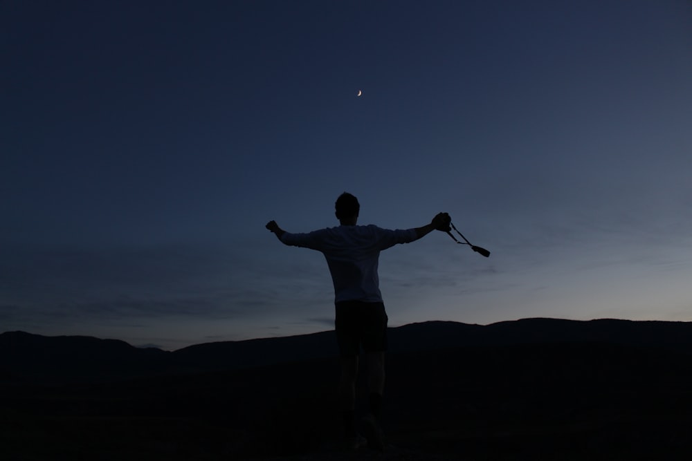 silhouette of man jumping up