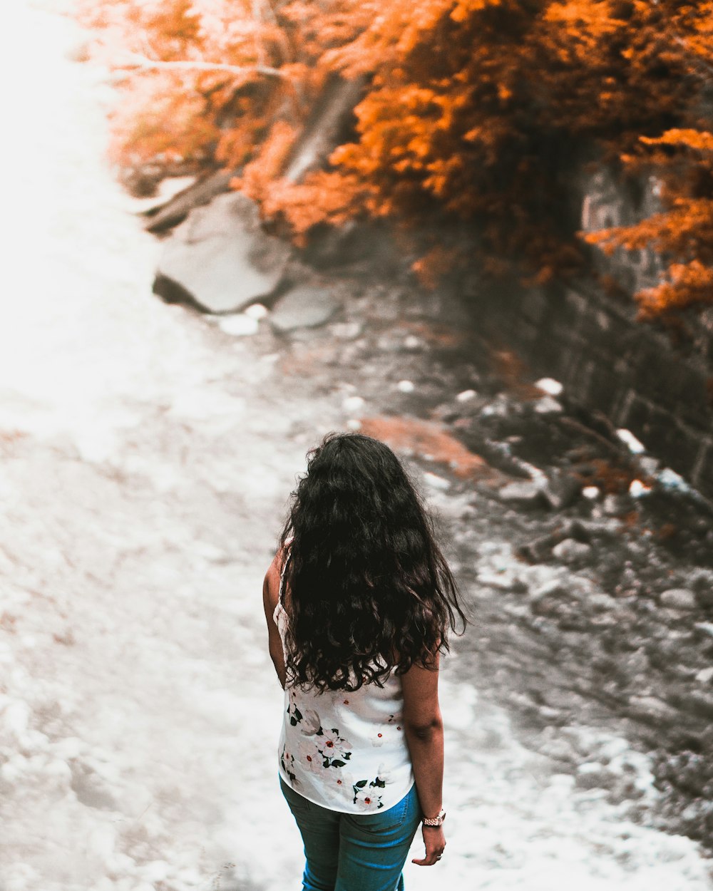 man stands beside river