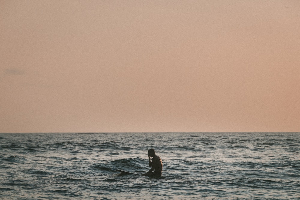 man standing on body of water