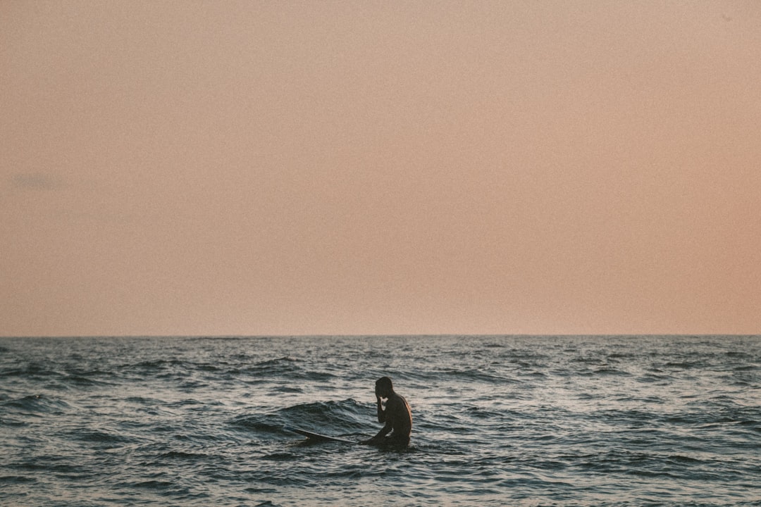 man standing on body of water