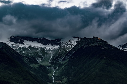 bird's-eye view photography of mountain range under cloudy sky in Zillertal Alps Italy