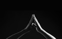 person's hands forming triangle