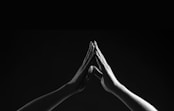person's hands forming triangle