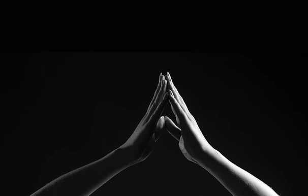 A serene Tai Chi diagram softly illuminated against a dark background.