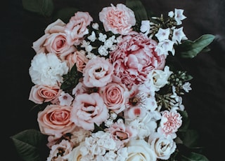 white and pink petaled flower arrangement