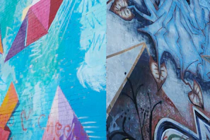 A colorful urban mural blending abstract shapes and bold lines on a city wall