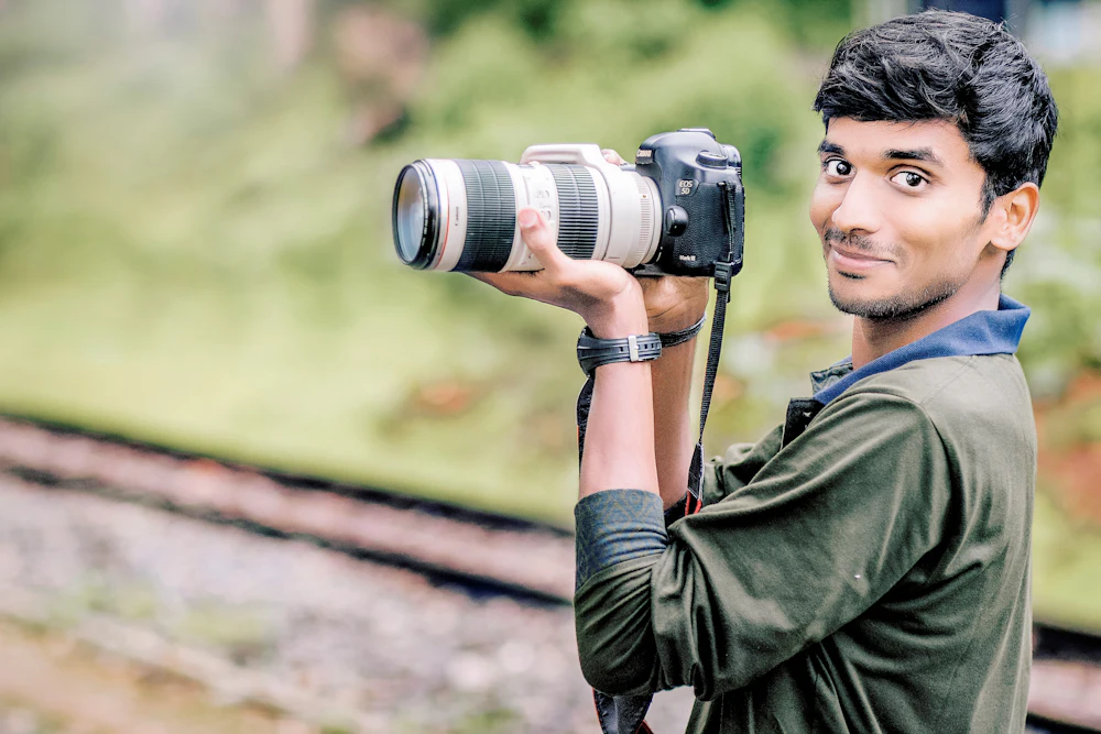 A photographer taking a photo, in selective focus