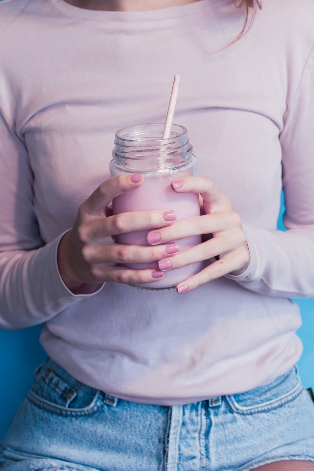 unknown person holding glass jar