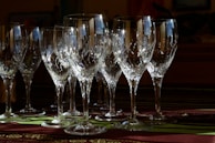 Close-up of crystal glasses catching the light, highlighting their fine details and clarity.
