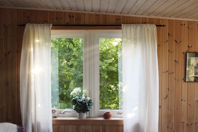 white rod pocket curtain on window frame