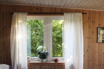 white rod pocket curtain on window frame window zoom background