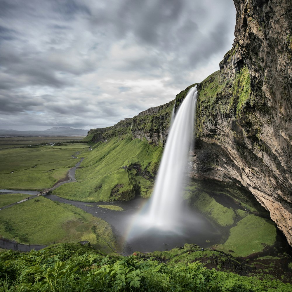 time lapse photography of waterfall