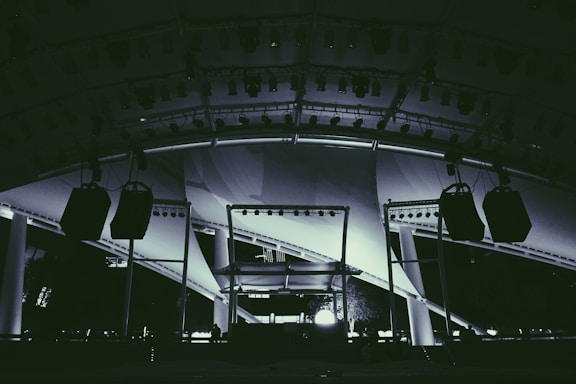 A professional event setup showcasing sound and lighting equipment.