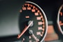 closeup photo of black analog speedometer