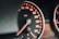 closeup photo of black analog speedometer