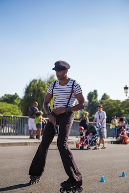A group of children learning to roller skate together on a sunny day in Hasharon park.