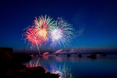 green, red, and white fireworks on sky at nighttime celebration google meet background