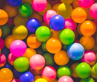high angle photo of assorted-color plastic balls