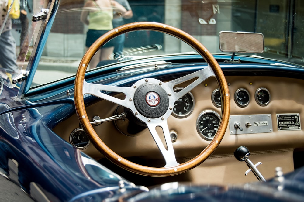 brown and gray steering wheel of vehicle on street