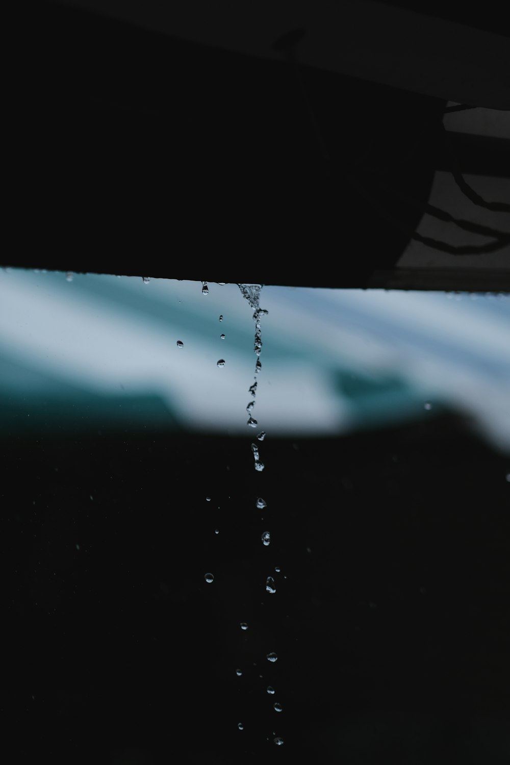 low-light photo of water drops