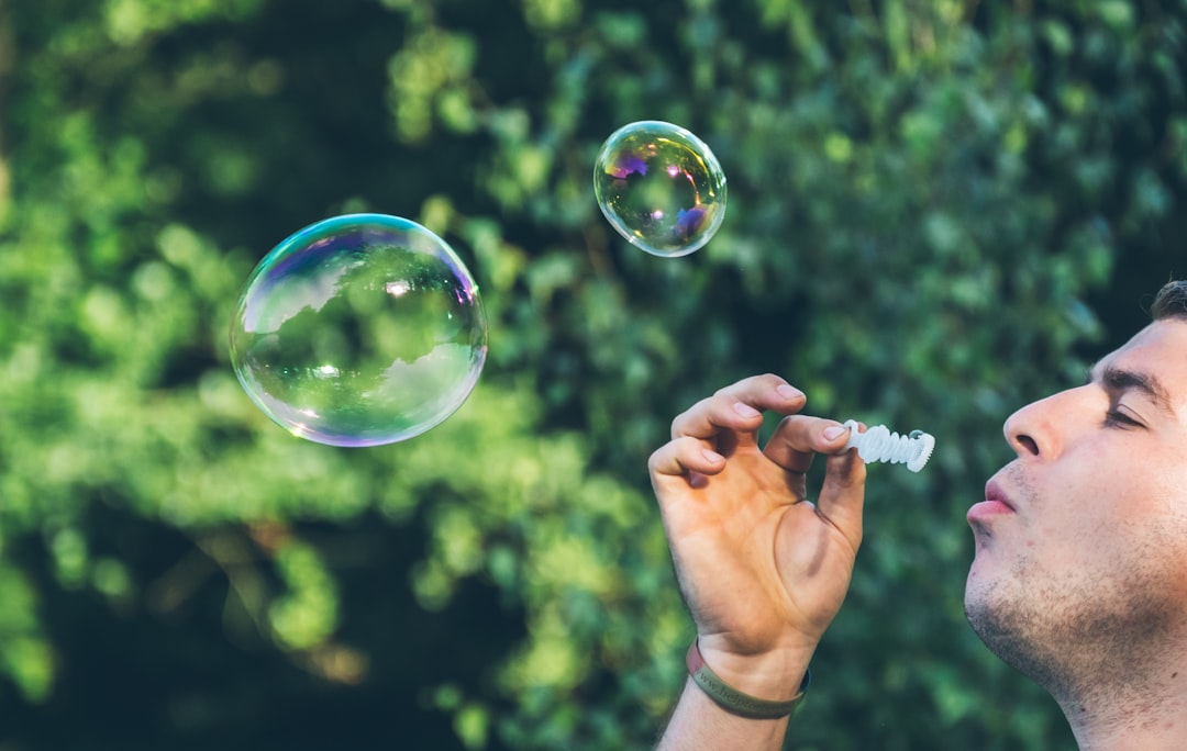 man playing bubbles