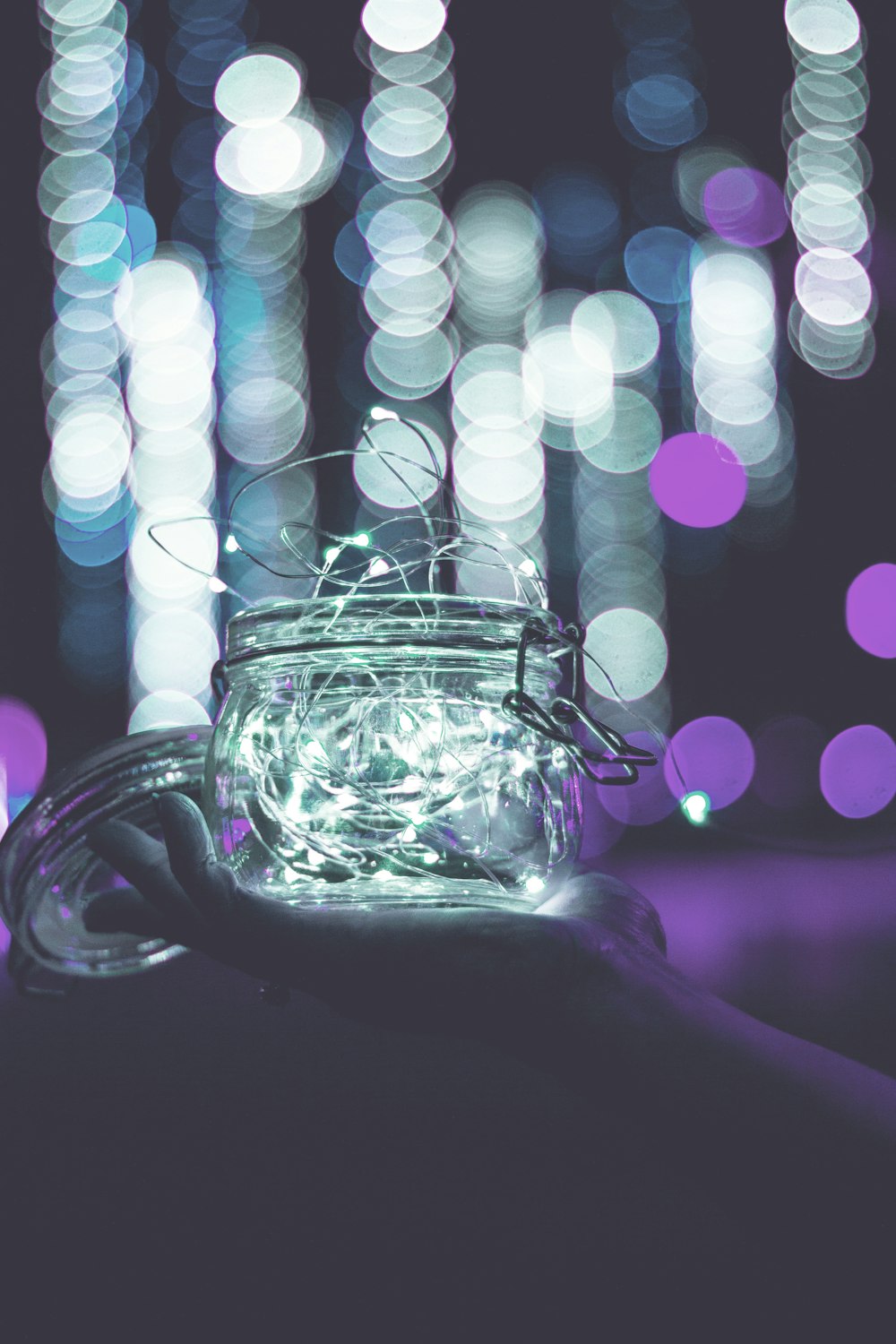 clear glass jar with string lights