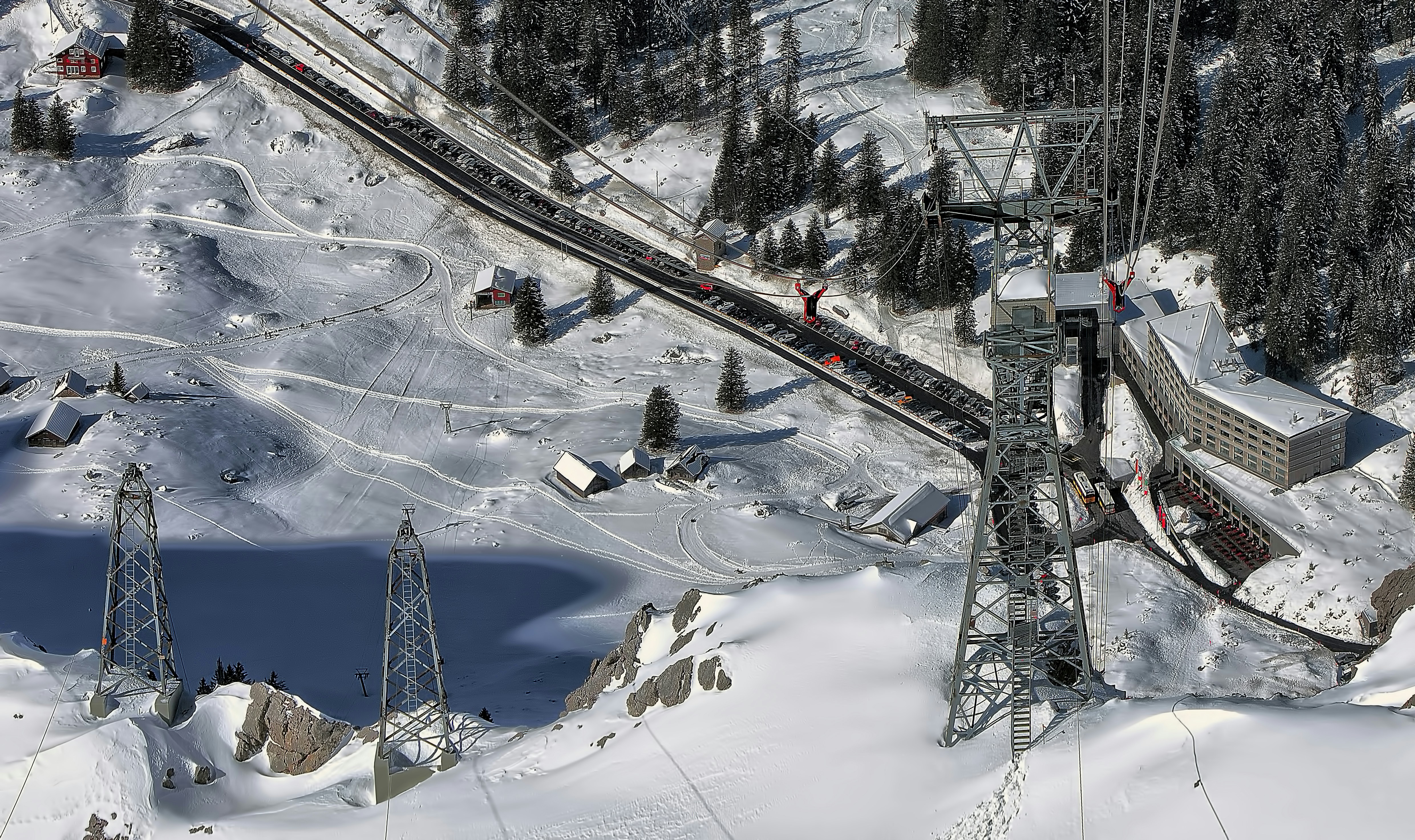 aerial photo of snow terrain near railway during daytime