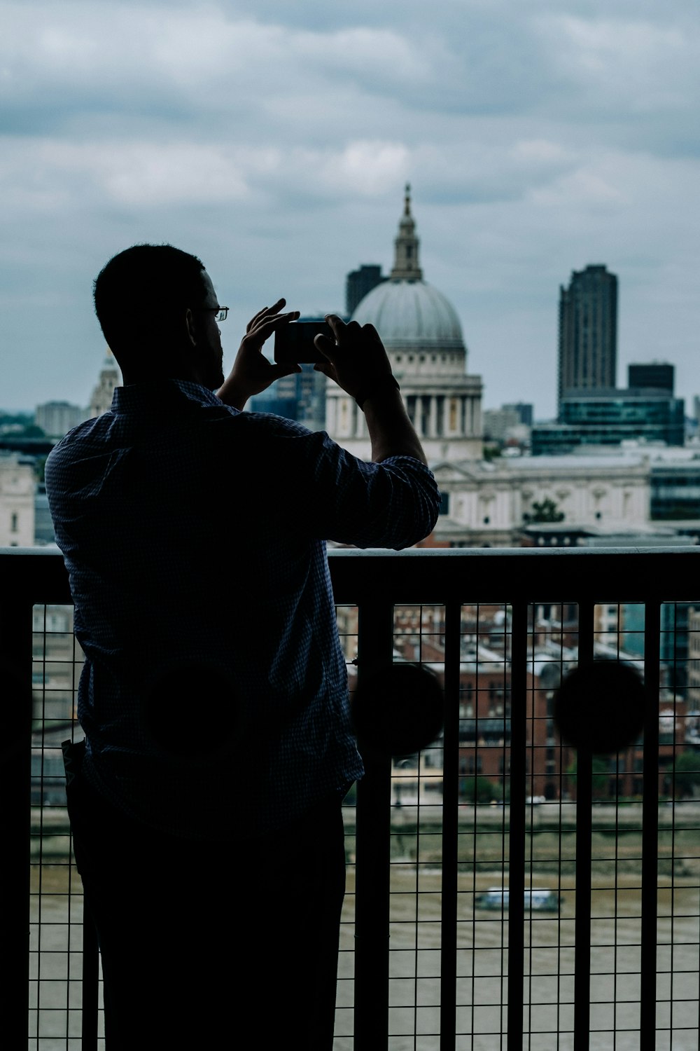 person taking photo of cathedral