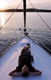 man lying on white boat