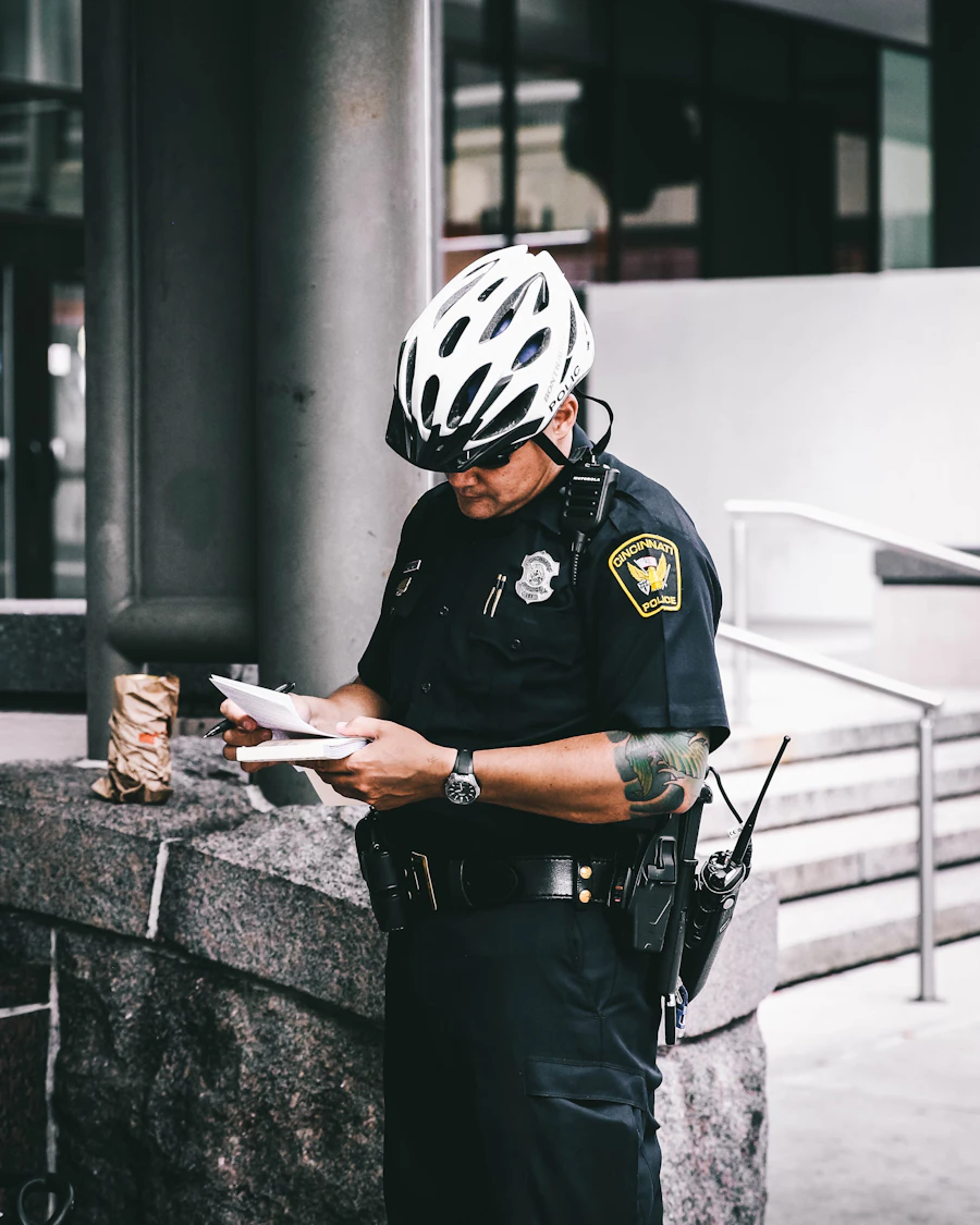 Uniformed officer reviewing shift documentation