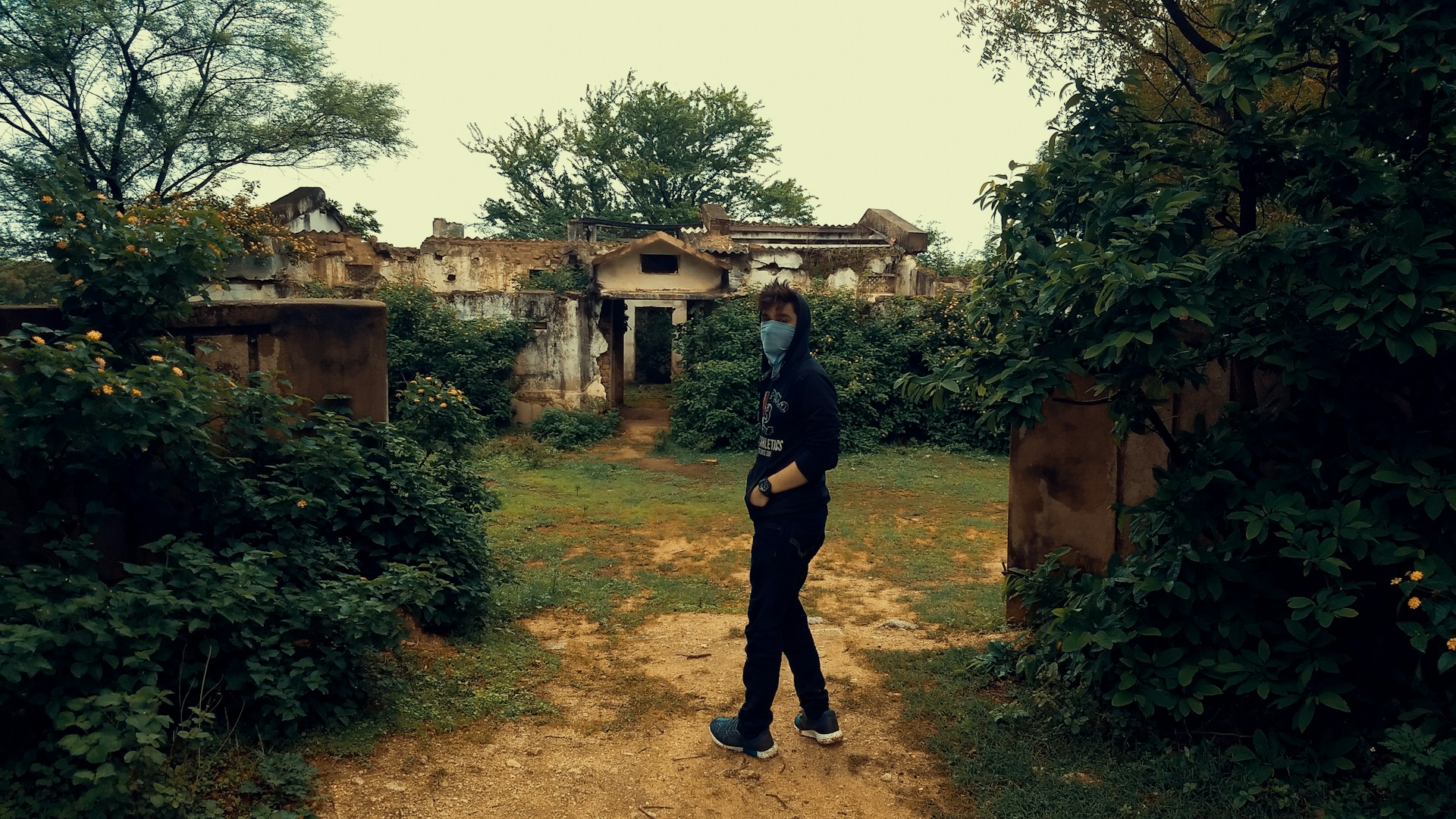 Lara Croft-style explorer standing confidently in a dense jungle with ancient ruins in the background, evoking a sense of adventure.