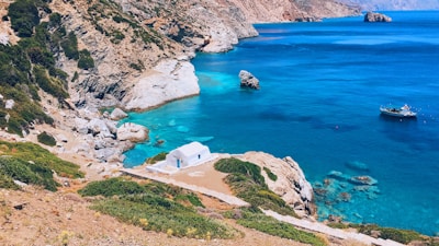 A serene Mediterranean coastline view linking Malta and Tunisia.